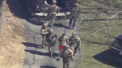 Jack Teixeira taken into custody by armed tactical agents