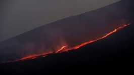 Lava flows downhill as Mount Etna erupts